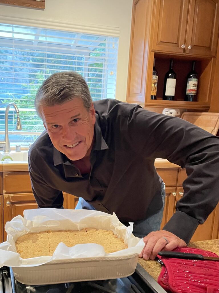 Mike in his kitchen with a pan of shortbread